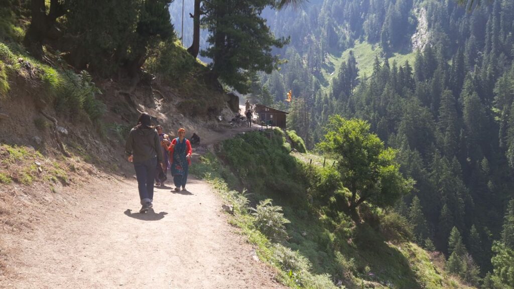 Local villagers walking along the Kugti Trek